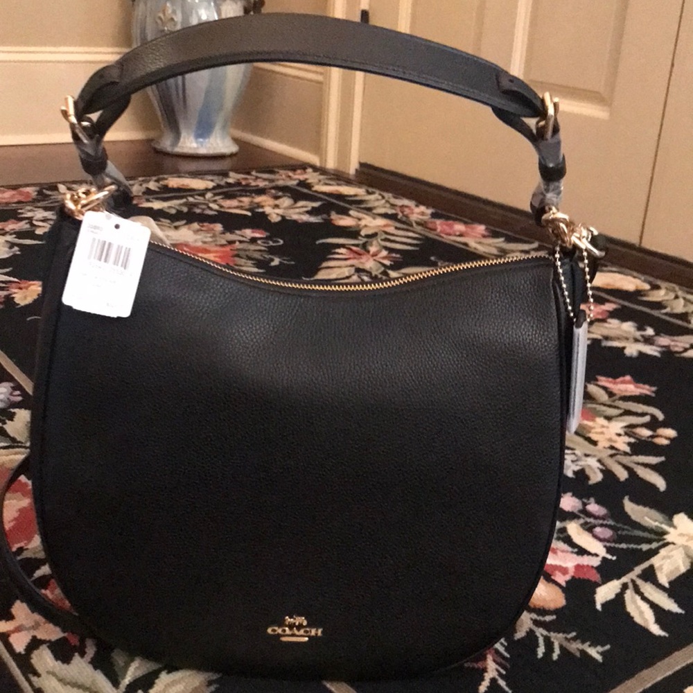 Coach Sutton in pebble polished leather.